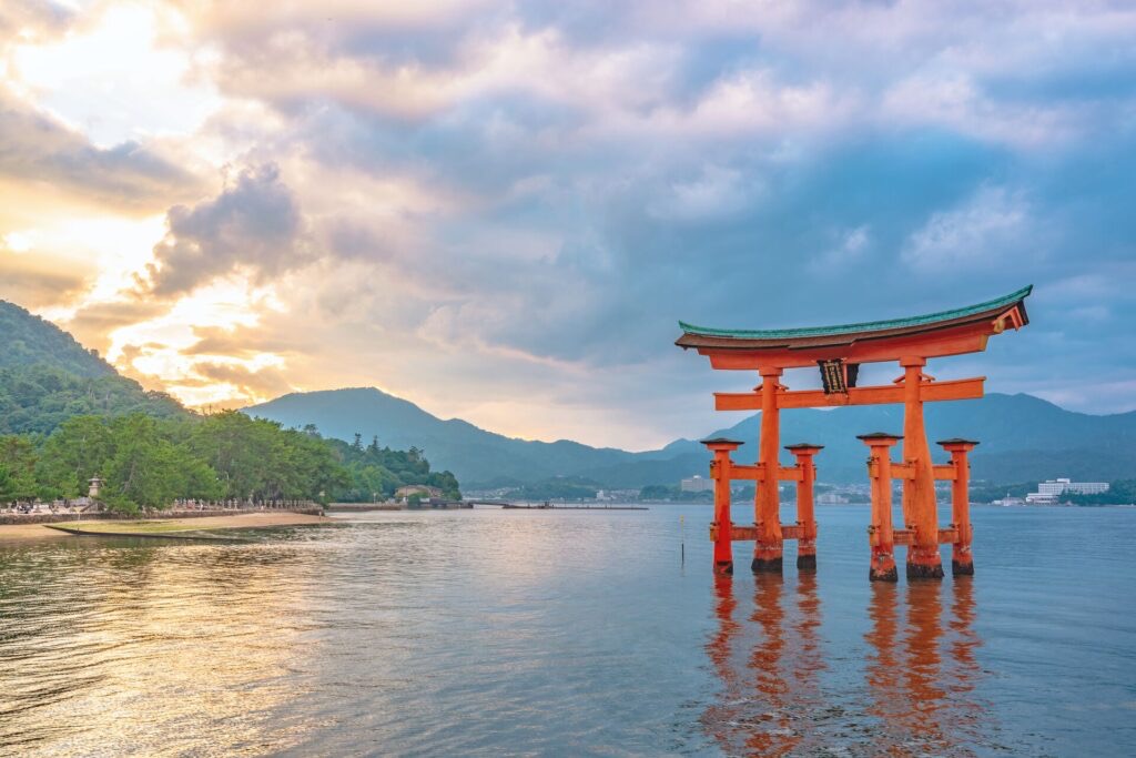 Red torii gate standing in the water at Itsukushima